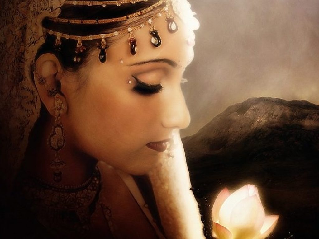 side view of a attractive female wearing bridal dress and jewelry